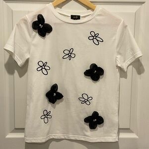 Charming White Kids Tee with Black Floral Design